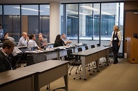 A woman speaks to the External Advisory Committee