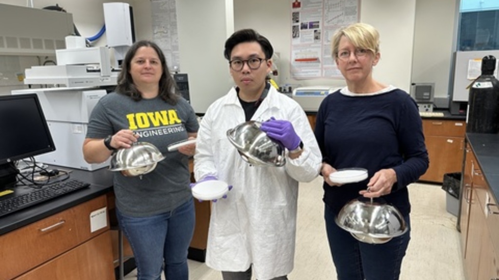 Rachel Marek, Jason Hua, and Keri Hornbuckle pose for a photo in the lab